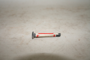 0312            石锥
一般文物      新石器时代
长5.0、宽1.77、高0.9、高0.01