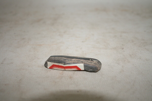 0310        石凿
一般文物    新石器时代
长5.7、宽1.6、高1.0、重0.02